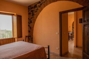 A bed or beds in a room at Agriturismo Mercurio Még 37 kép