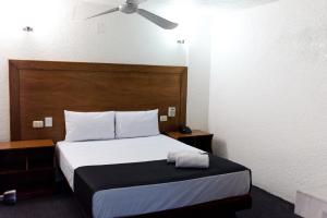 Voodi või voodid majutusasutuse Hotel Central Irapuato - Hotel en Irapuato toas