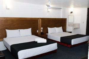 Voodi või voodid majutusasutuse Hotel Central Irapuato - Hotel en Irapuato toas