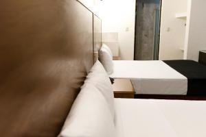 Voodi või voodid majutusasutuse Hotel Central Irapuato - Hotel en Irapuato toas