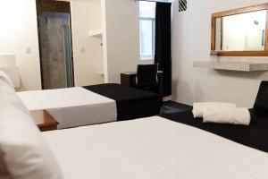 Voodi või voodid majutusasutuse Hotel Central Irapuato - Hotel en Irapuato toas