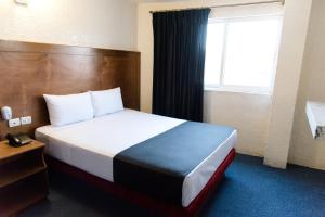 Voodi või voodid majutusasutuse Hotel Central Irapuato - Hotel en Irapuato toas