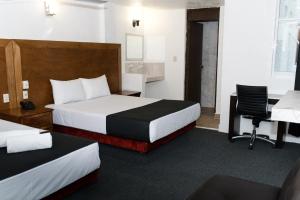 Postel nebo postele na pokoji v ubytování Hotel Central Irapuato - Hotel en Irapuato + 19 fotografií
