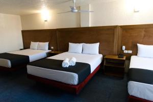 Postel nebo postele na pokoji v ubytování Hotel Central Irapuato - Hotel en Irapuato