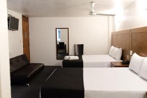 Voodi või voodid majutusasutuse Hotel Central Irapuato - Hotel en Irapuato toas