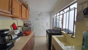 Kuchyň nebo kuchyňský kout v ubytování Hostal Base Camp México