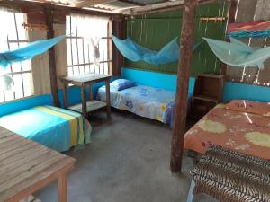 Postel nebo postele na pokoji v ubytování Ecohotel Arte y Aventura