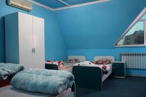 En eller flere senge i et værelse på ECOPANA