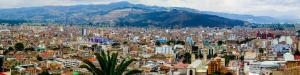 a large city with buildings and mountains in the background at Hotel Sogamoso Real in Sogamoso