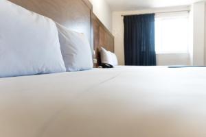 Voodi või voodid majutusasutuse Hotel Central Irapuato - Hotel en Irapuato toas