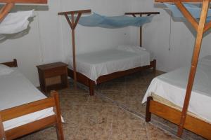 Postel nebo postele na pokoji v ubytování Tambopata Hostel