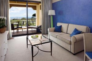 a living room with a couch and a table at Cascade Wellness Resort in Lagos