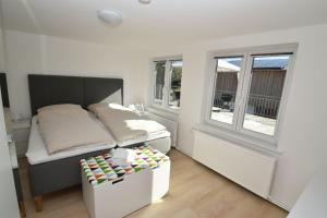 a small bedroom with a bed and a window at fewo1846 - Solskin - ländlich gelegene Wohnung mit 2 Schlafzimmern in Flensburg