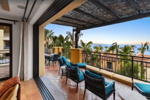 a balcony with chairs and a view of the ocean at Best Executive-Style Luxury Residence on Property in Cabo San Lucas