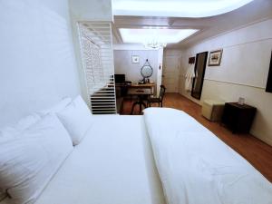 Postel nebo postele na pokoji v ubytování Uneed Hotel