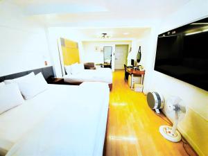 TV a/nebo společenská místnost v ubytování Uneed Hotel