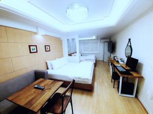 Postel nebo postele na pokoji v ubytování Uneed Hotel