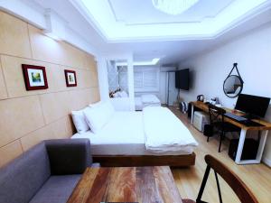 Postel nebo postele na pokoji v ubytování Uneed Hotel