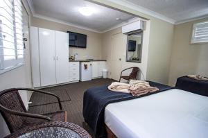 Kuchyň nebo kuchyňský kout v ubytování Tropicana Motel