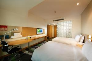 Postel nebo postele na pokoji v ubytování Holiday Inn Express Tangshan Downtown by IHG