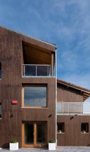 an office building with a wooden facade at Hotel Nafarrola - Gastronomy & Wine in Bermeo