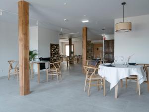 a dining room with a table and chairs at Hotel Nafarrola - Gastronomy & Wine in Bermeo
