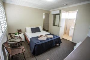 Postel nebo postele na pokoji v ubytování Tropicana Motel