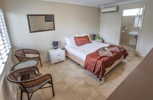 Postel nebo postele na pokoji v ubytování Tropicana Motel