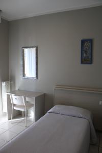 Postel nebo postele na pokoji v ubytování Hotel Delfina