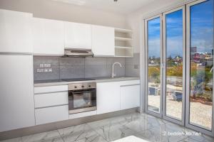 Kuchyňa alebo kuchynka v ubytovaní Nissi49 Apartments