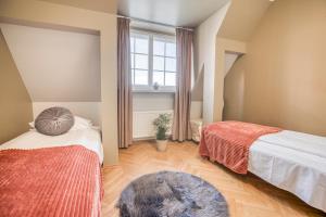 Llit o llits en una habitació de Historic Residence Apartments at Old Town