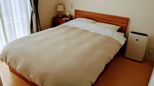 A bed or beds in a room at Fujiyasan