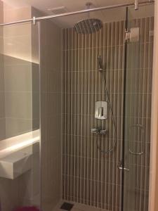 a shower with a glass door in a bathroom at KL TOWER & KLCC VIEW HOTEL SUITE @ SUASANA BUKIT CEYLON BUKIT BINTANG in Kuala Lumpur +9 photos