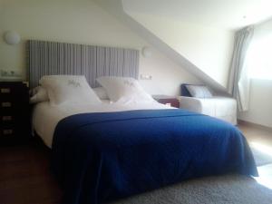 Cama o camas de una habitación en Hotel Mabel
