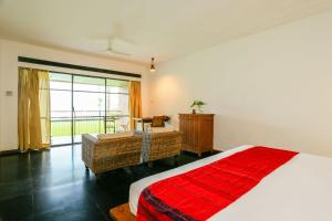 Rainforest Resort客房内的一张或多张床位