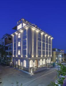 a large white building with lights on it at SHAHPURA DEV PANACHE in Udaipur