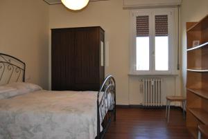 Postel nebo postele na pokoji v ubytování Lombardi Fleming