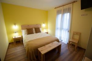 A bed or beds in a room at La Casona de Cardes