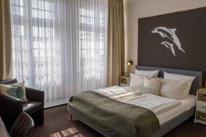 Letto o letti in una camera di AKZENT Strandhotels Seestern, Delphin & Lachs
