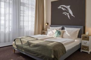 Letto o letti in una camera di AKZENT Strandhotels Seestern, Delphin & Lachs