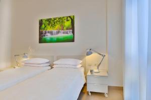A bed or beds in a room at UR-NEST Galleria del Toro