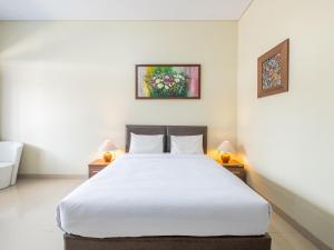 Postel nebo postele na pokoji v ubytování Hotel Parahyangan