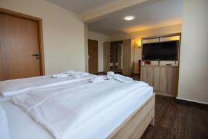 Postel nebo postele na pokoji v ubytování Hotel Wikinger