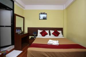 Ein Bett oder Betten in einem Zimmer der Unterkunft New Hotel Panda