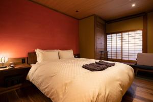 Letto o letti in una camera di 祇園の宿 杏花