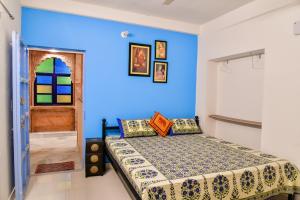 Ένα ή περισσότερα κρεβάτια σε δωμάτιο στο Aura B&B - The Haveli Homestay