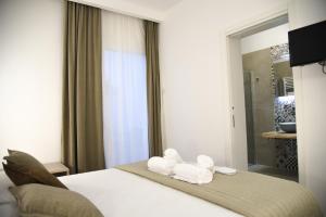 Postel nebo postele na pokoji v ubytování Hotel Belsito
