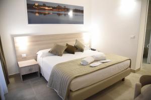 Postel nebo postele na pokoji v ubytování Hotel Belsito