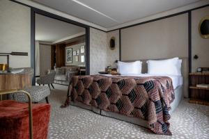 a bedroom with a large bed with a large mirror at Esprit Saint Germain in Paris