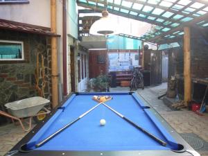 a pool table in the middle of a courtyard at Complex Vile Daniel in Sinaia